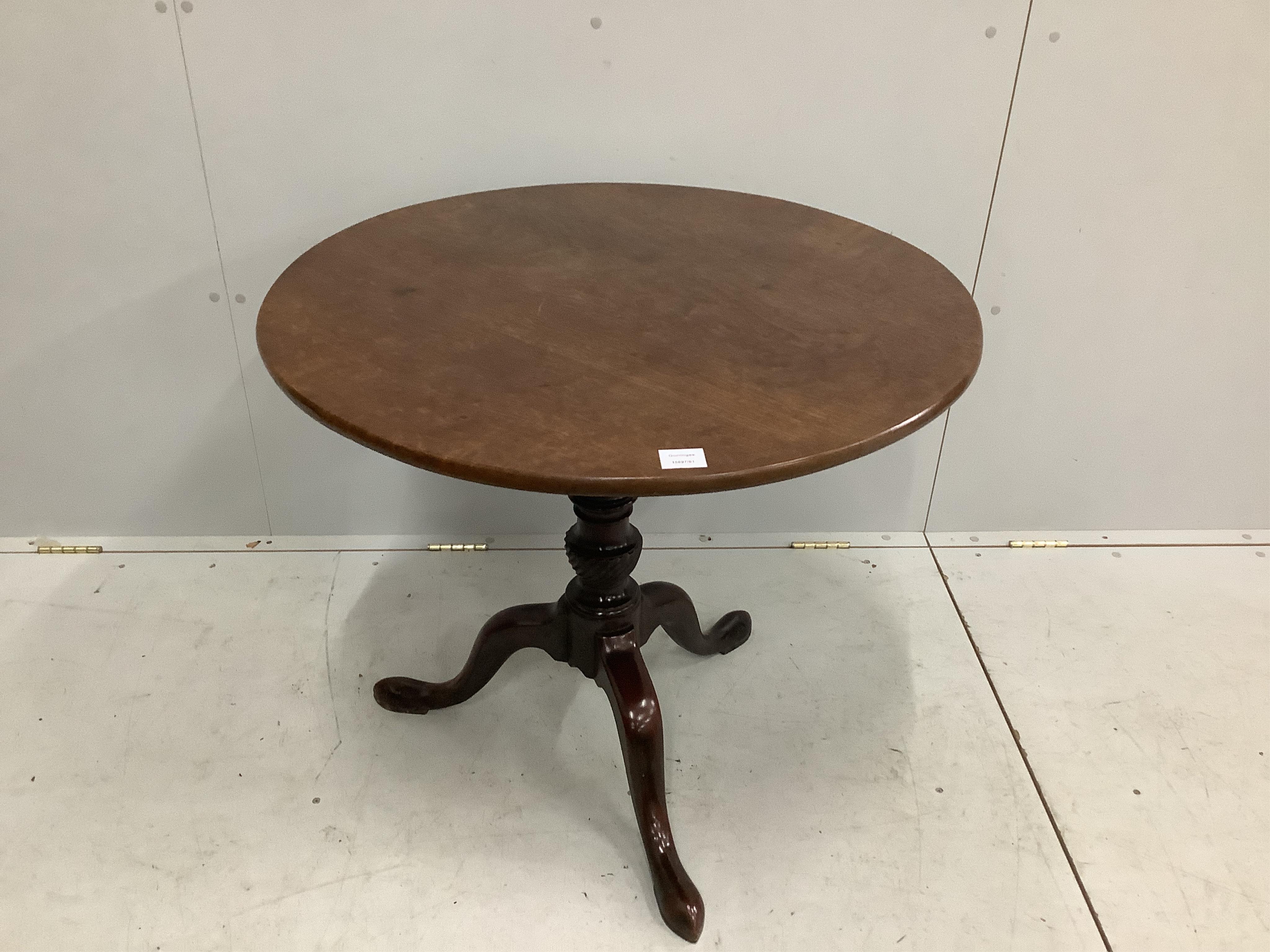 A George III circular mahogany tilt-top tripod tea table, diameter 82cm, height 71cm. Condition - fair